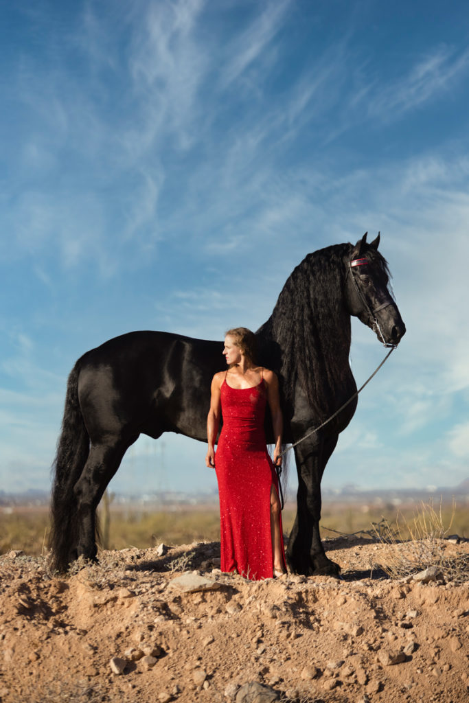 a woman withe a black horse